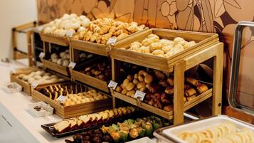 A bakery display with various pastries and baked goods.