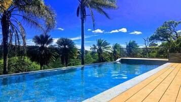 Outdoor pool, open 6:00 AM to 9:00 PM, pool loungers
