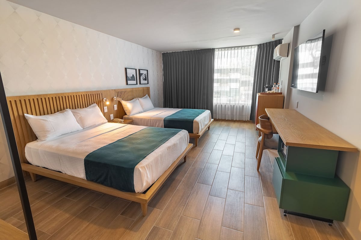 Executive kamer, 2 tweepersoonsbedden | 1 slaapkamer, een bureau, gratis wifi, beddengoed