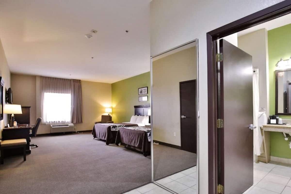 Premium bedding, desk, laptop workspace, blackout curtains