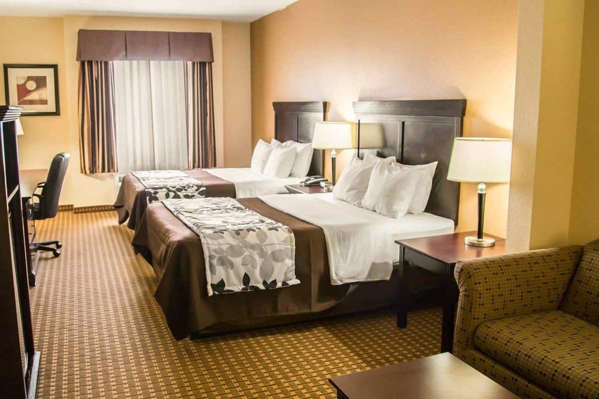 Premium bedding, desk, laptop workspace, blackout curtains