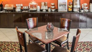 A breakfast area with a counter, coffee machine, and a refrigerator. - Sleep Inn & Suites Abilene Near University (Abilene)