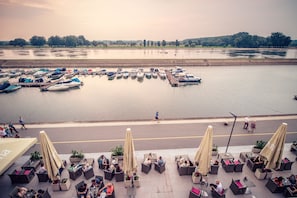 Sit and enjoy the serene marina views from this riverside seating area.