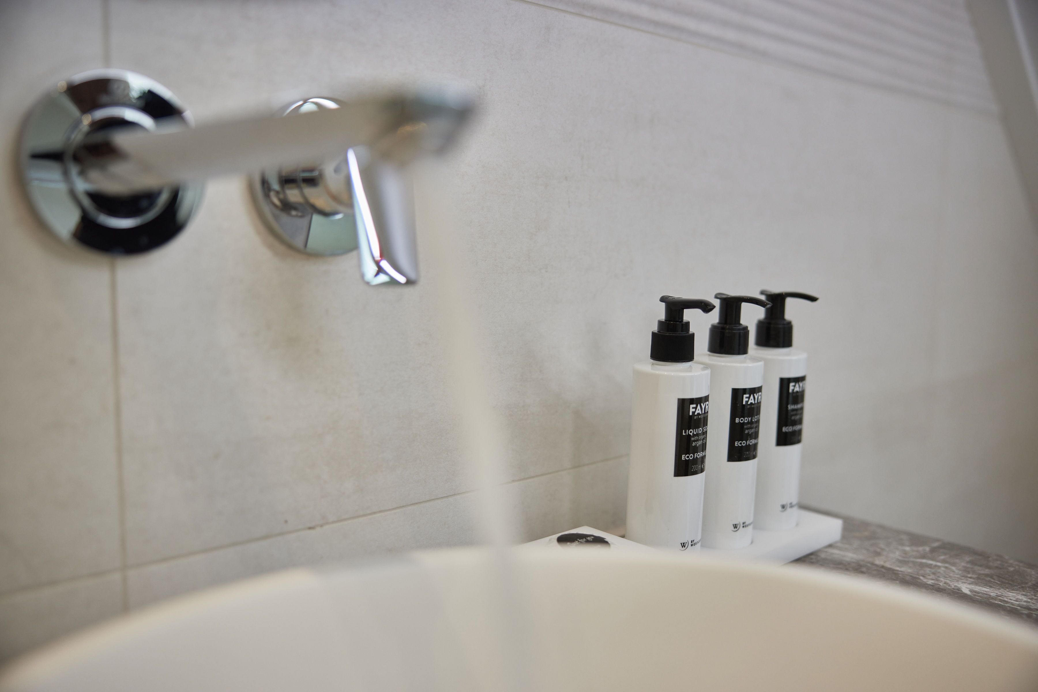 superior double room | bathroom | separate bathtub and shower, eco-friendly toiletries, hair dryer, towels