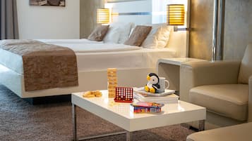 Relax in this inviting space with a comfortable bed, a cozy reading nook, and a stylish seating area.