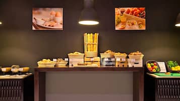 A buffet counter with various food items and baskets.