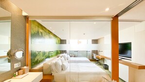 A modern hotel room with a large bed, a separate desk, a television, and a bathroom with a bathtub. - The Westin Shenzhen Nanshan (Shenzhen)