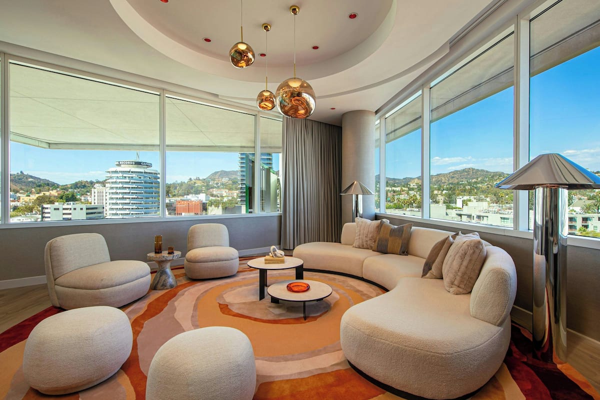 Penthouse Suite | Living room | 42-inch flat-screen TV with cable channels, TV, iPod dock