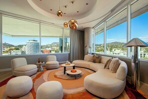 Penthouse Suite | Living room | 42-inch flat-screen TV with cable channels, TV, iPod dock