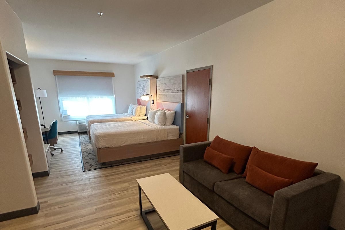 Suite, 2 Queen Beds, Non Smoking, Refrigerator & Microwave (Shower Only;with Sofabed) | Desk, laptop workspace, iron/ironing board, cribs/infant beds