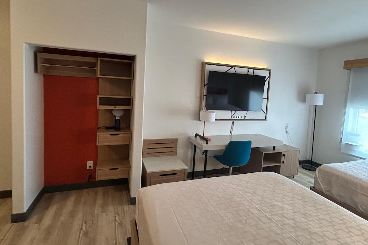 Desk, laptop workspace, iron/ironing board, cribs/infant beds