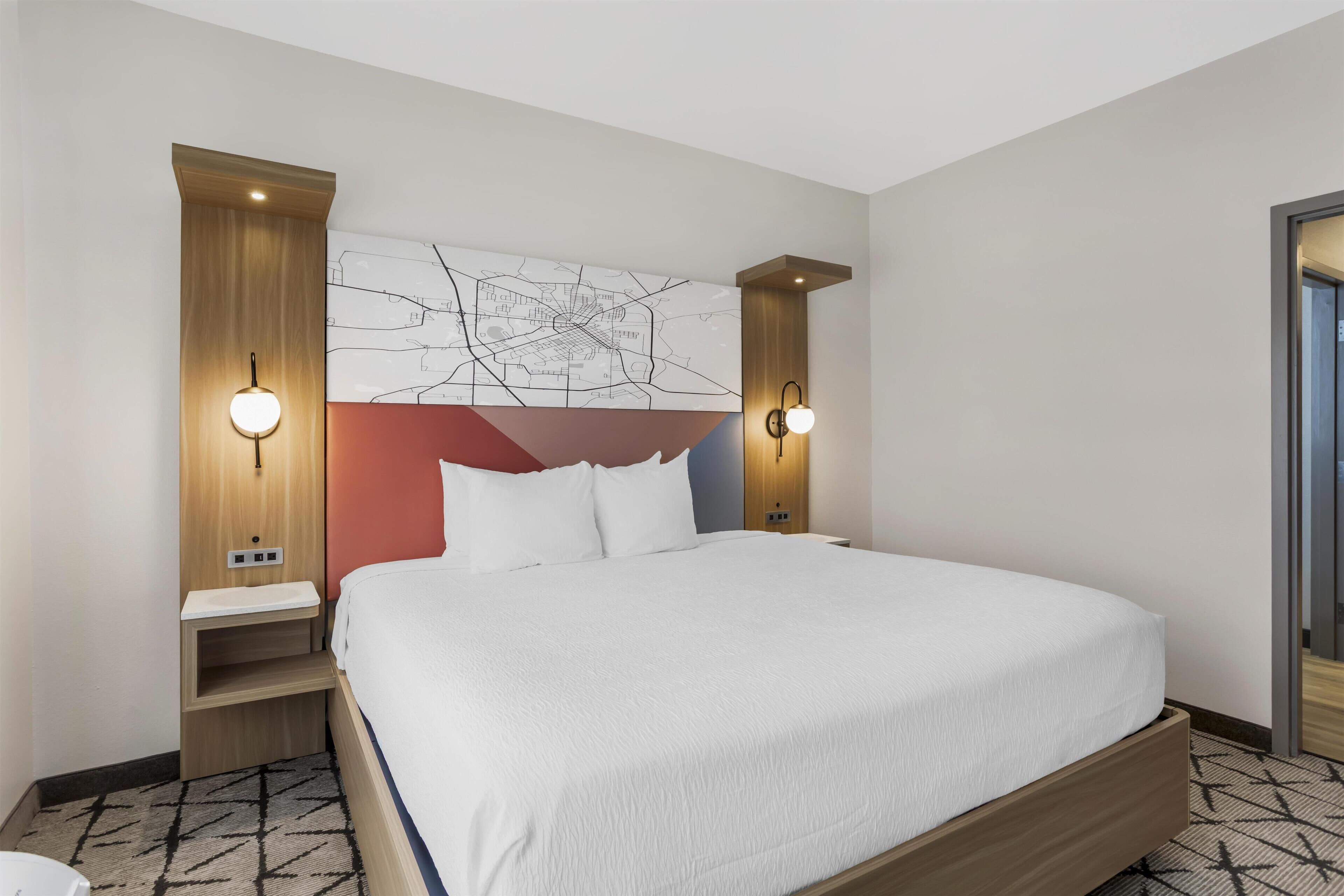 Suite, 1 King Bed, Non Smoking, Refrigerator & Microwave (Shower Only;with Sofabed) | Desk, laptop workspace, iron/ironing board, cots/infant beds