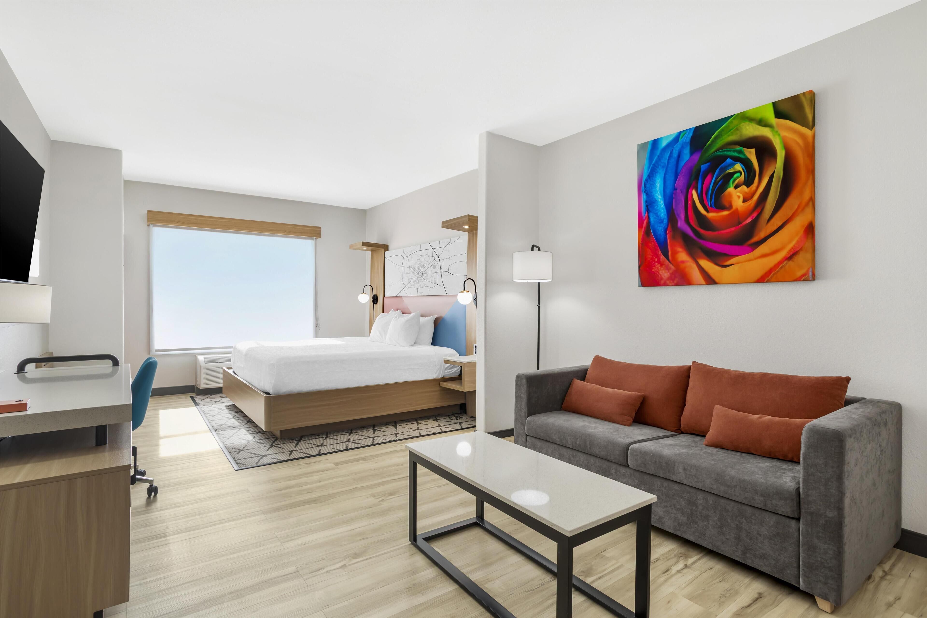 Suite, 1 King Bed, Non Smoking, Refrigerator & Microwave (Shower Only;with Sofabed) | Desk, laptop workspace, iron/ironing board, cots/infant beds