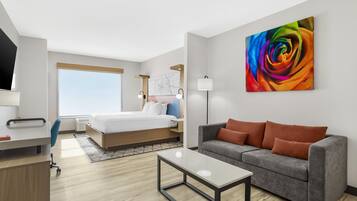 Suite, 1 King Bed, Non Smoking, Refrigerator & Microwave (Shower Only;with Sofabed) | Desk, laptop workspace, iron/ironing board, cots/infant beds