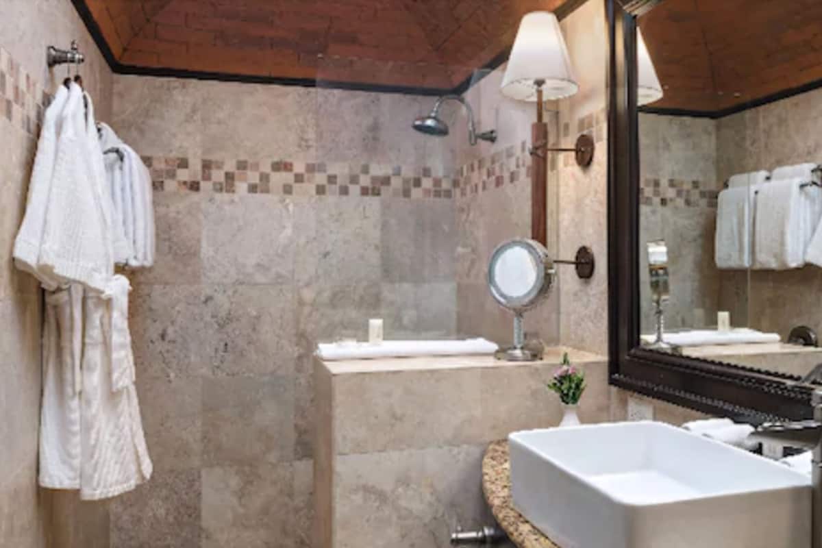 deluxe room, 2 queen beds | bathroom | shower, designer toiletries, hair dryer, bathrobes