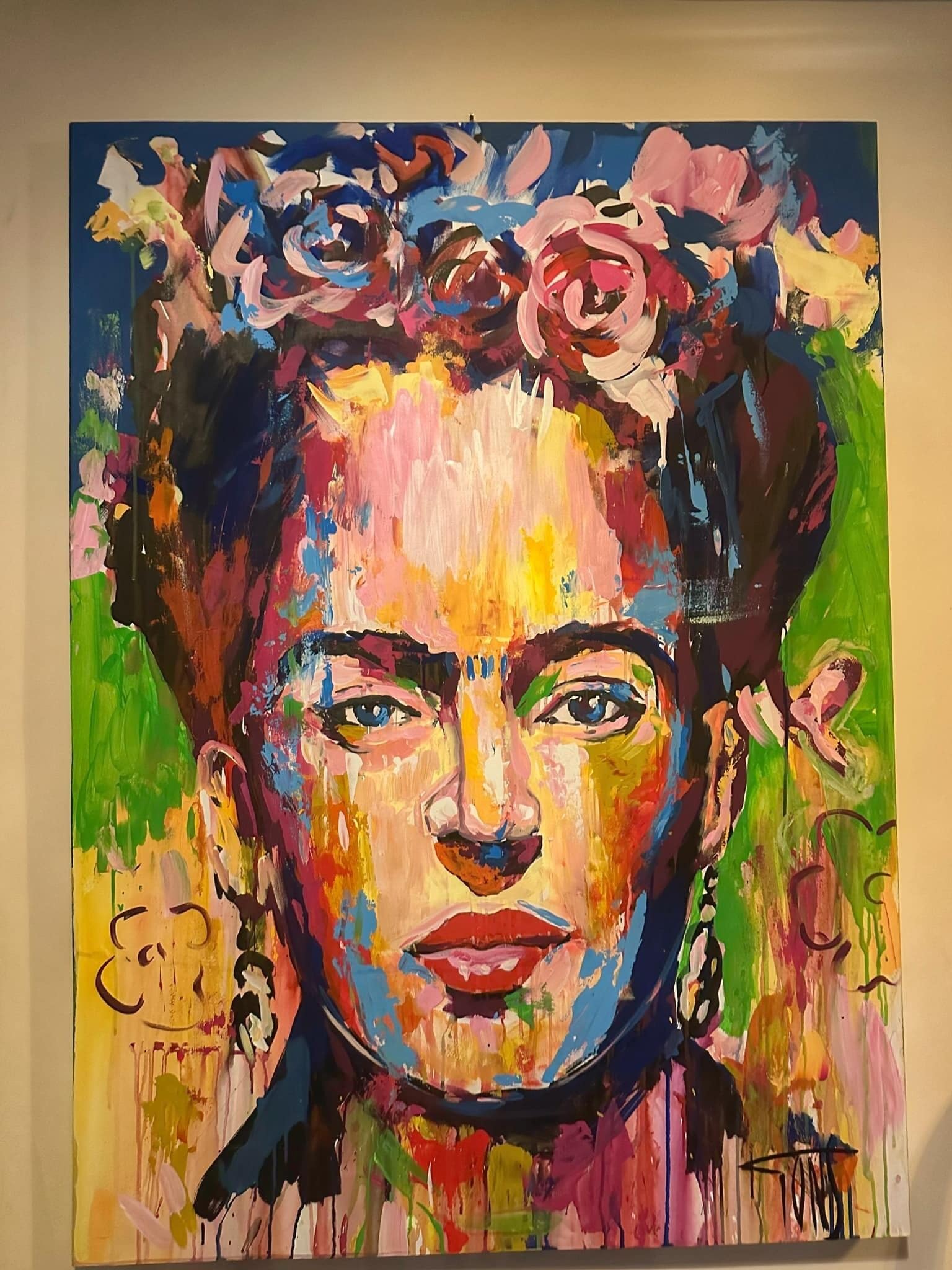 A colorful abstract painting with bold strokes and vibrant colors.