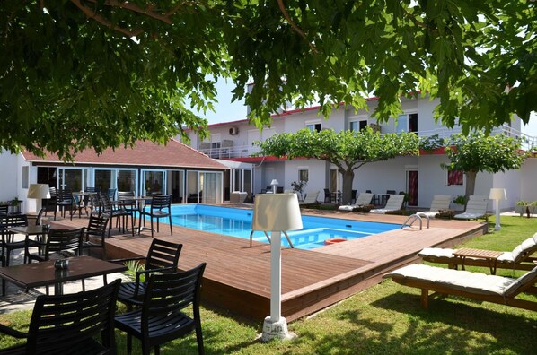 Outdoor pool, open 8:30 AM to 6 PM, pool umbrellas, sun loungers
