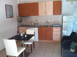 Full-size fridge, stovetop, coffee/tea maker, electric kettle
