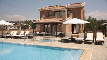 Seasonal outdoor pool, open 8 AM to 8 PM, pool umbrellas, sun loungers