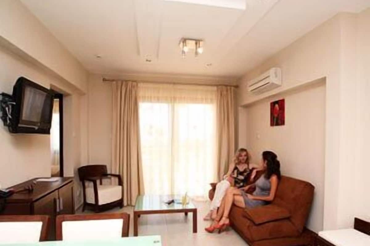 Superior Apartment, 1 Bedroom | Living room | 25-inch flat-screen TV with cable channels, TV
