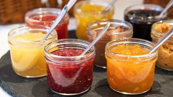 A selection of jars containing various jams and preserves.