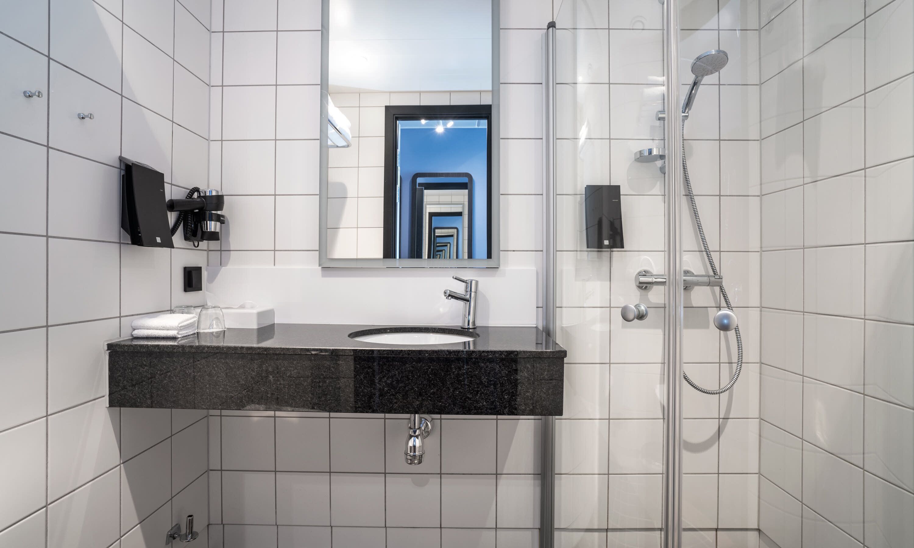 shower, eco-friendly toiletries, hair dryer, towels