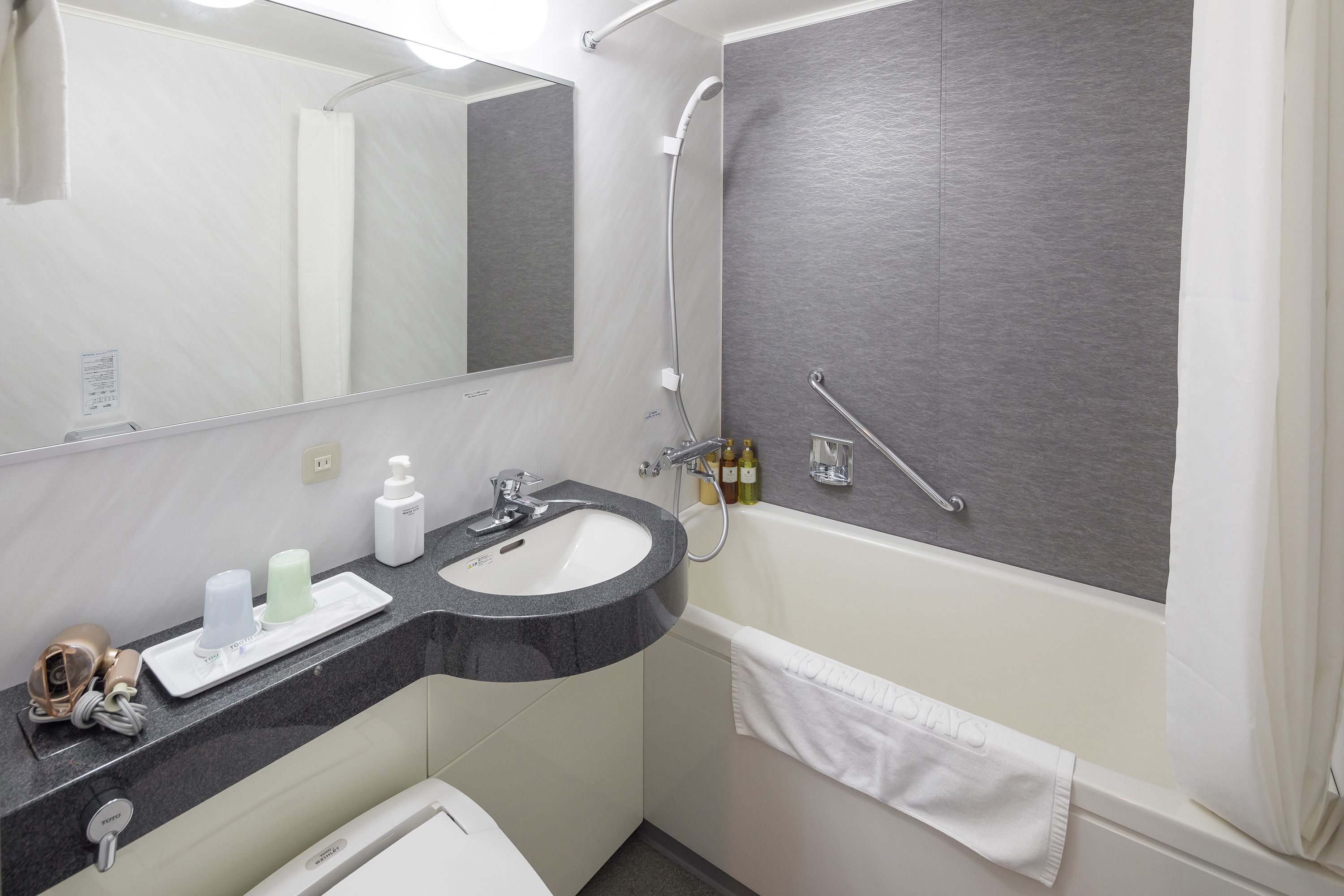 combined shower/bathtub, free toiletries, hair dryer, slippers