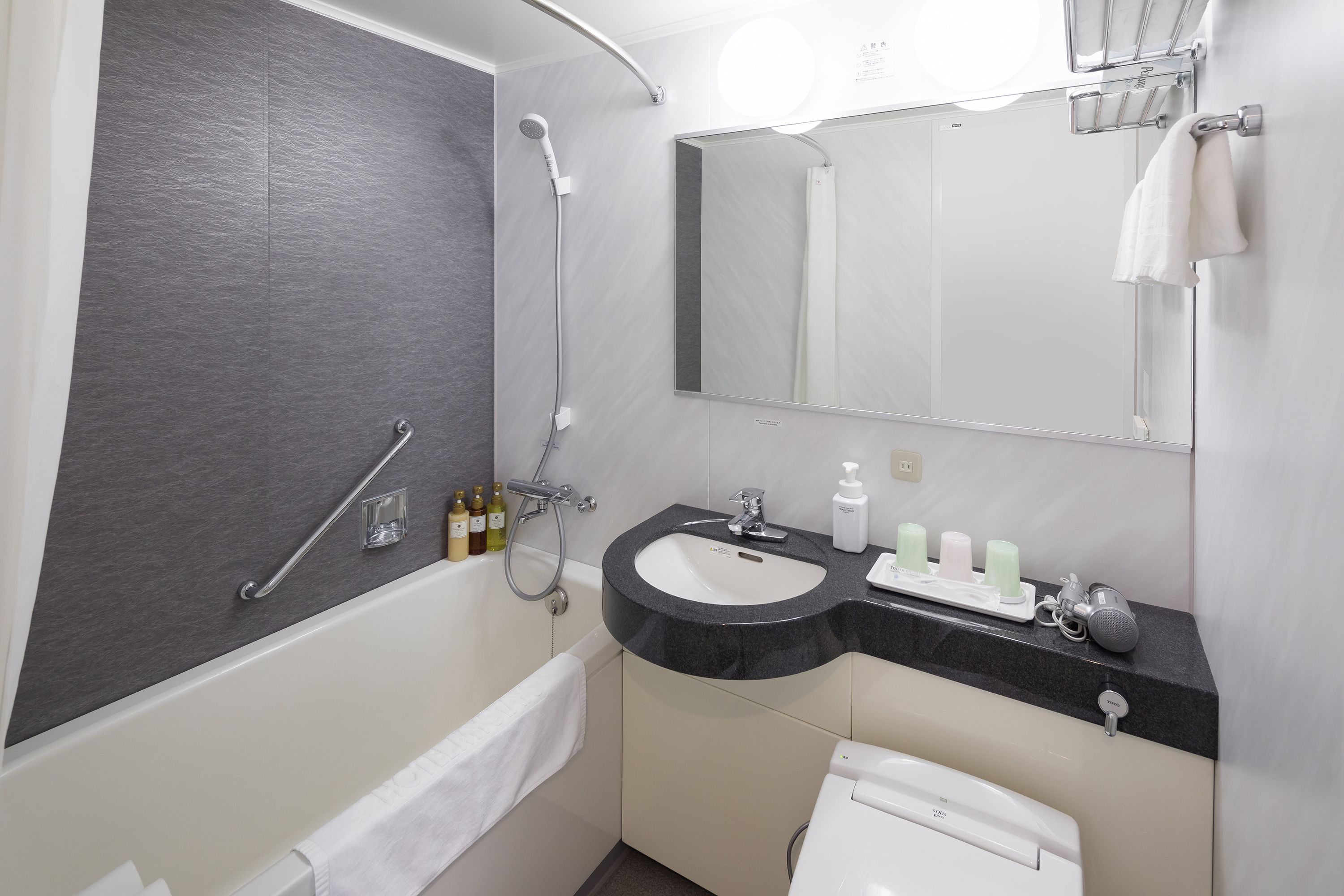 combined shower/bathtub, free toiletries, hair dryer, slippers