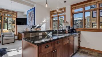 Luxury Condo, 2 Bedrooms | Private kitchen | Full-sized fridge, microwave, stovetop, dishwasher