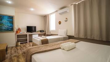 Suíte Deluxe | Frigobar, Wi-Fi de cortesia, roupa de cama