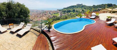 Seasonal outdoor pool, pool loungers