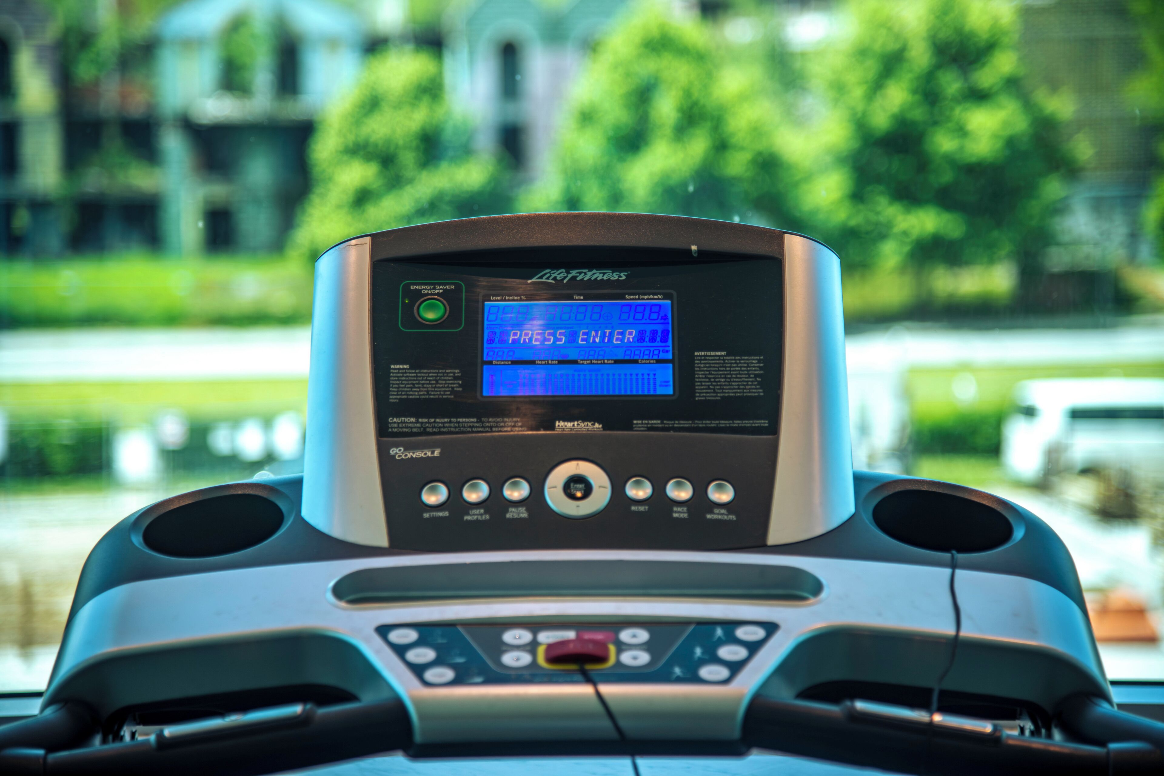 A treadmill with a digital display, control buttons, and a 'GO' console.