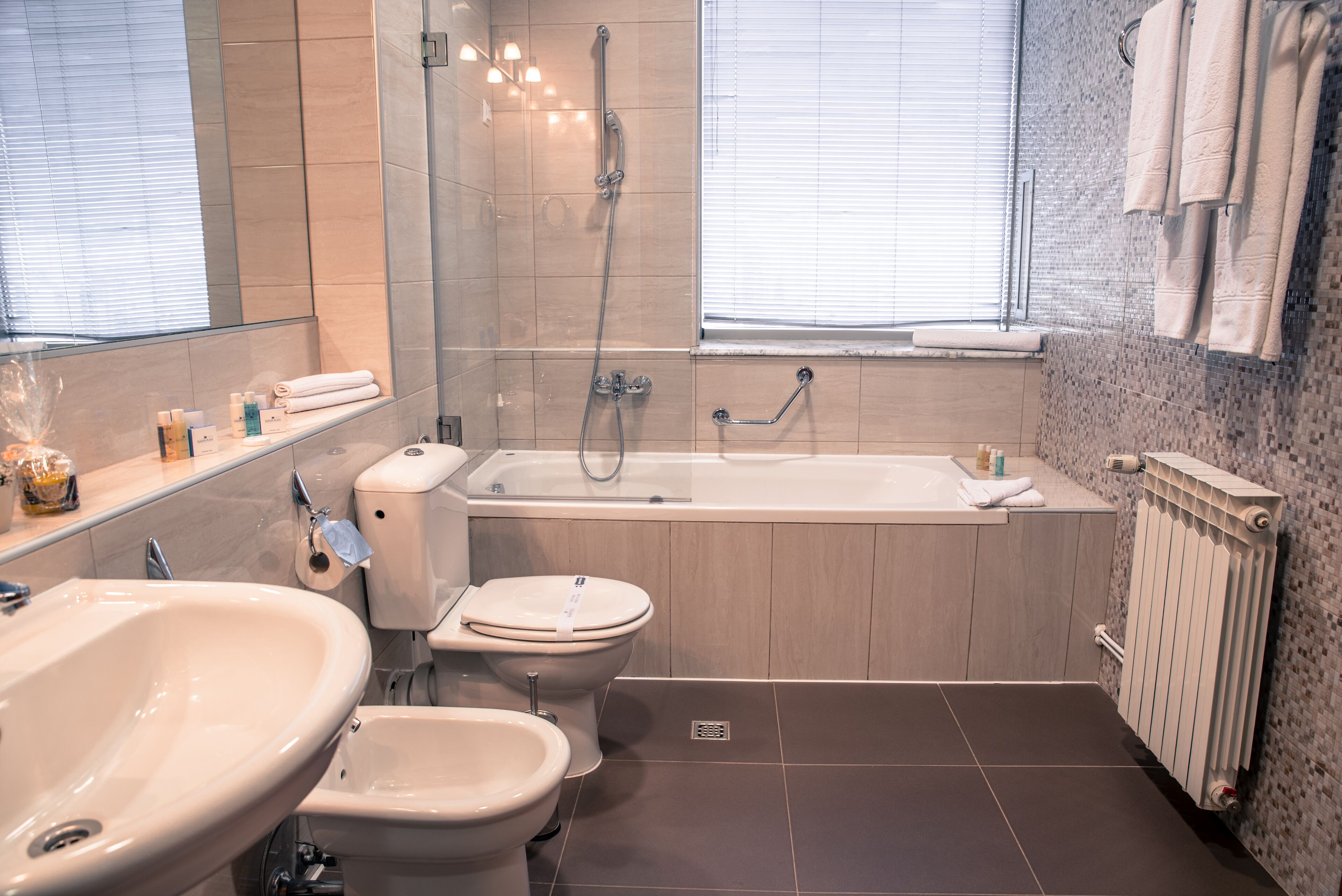 bathtub, free toiletries, hair dryer, slippers