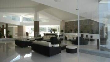 Relax in a spacious, open-plan living area with a comfortable seating area and modern kitchen.