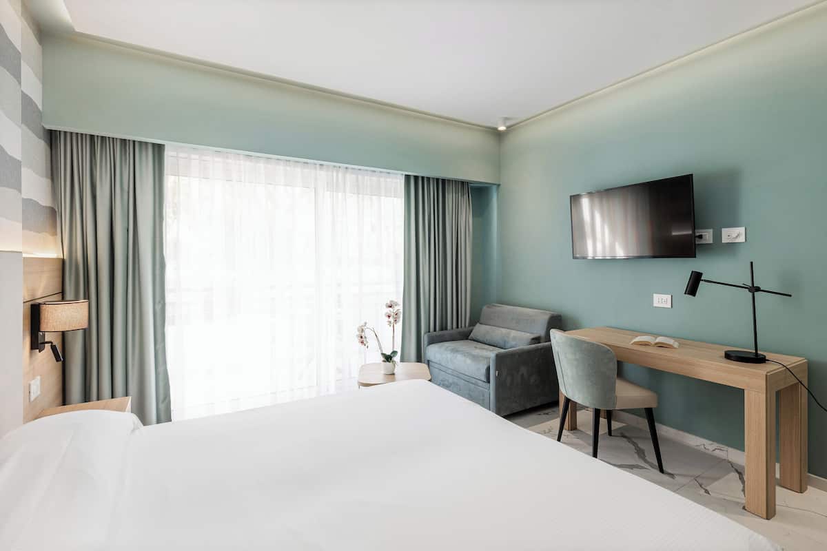 1 habitación, caja de seguridad en la habitación y ropa de cama