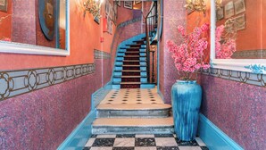 A grand staircase with a checkered floor leading to a second floor. - Hotel De Nice (Paris)