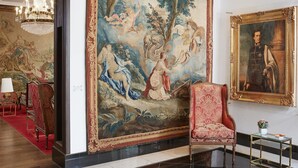 A luxurious room with a large Rococo-style mural, elegant furniture, and a chandelier. - Living Hotel an der Oper (Vienna)