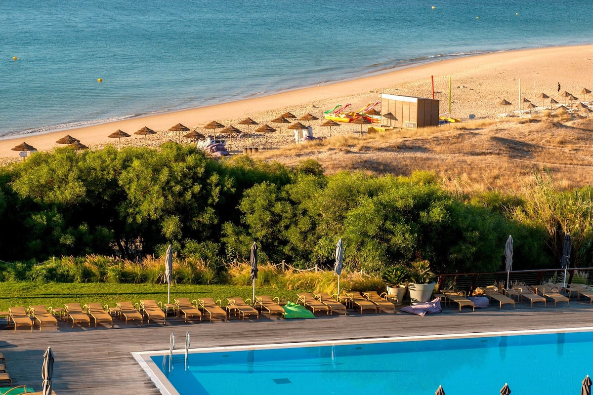 indoor pool, 3 outdoor pools, open 8 am to 8 pm, pool umbrellas