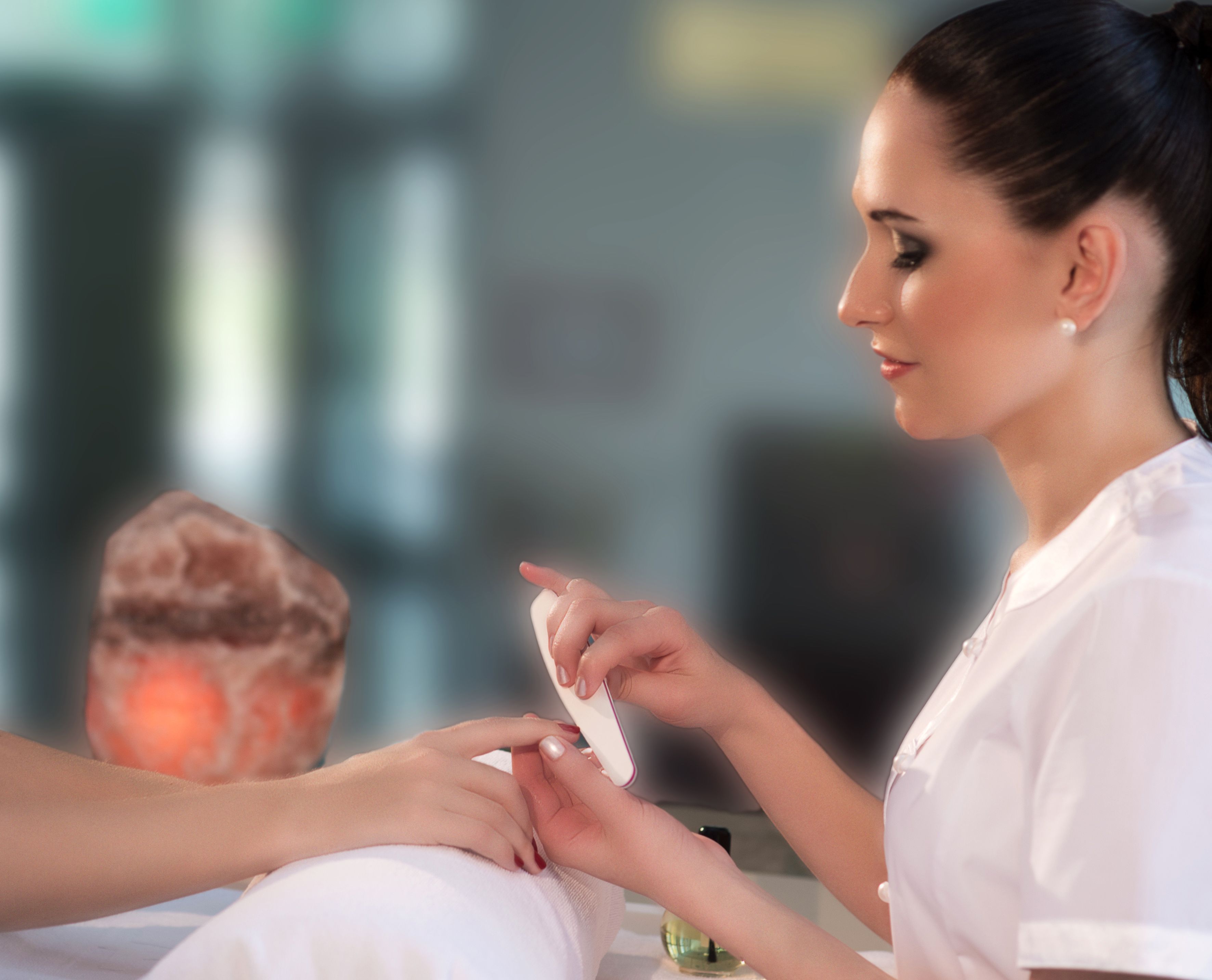 A person receiving a manicure.