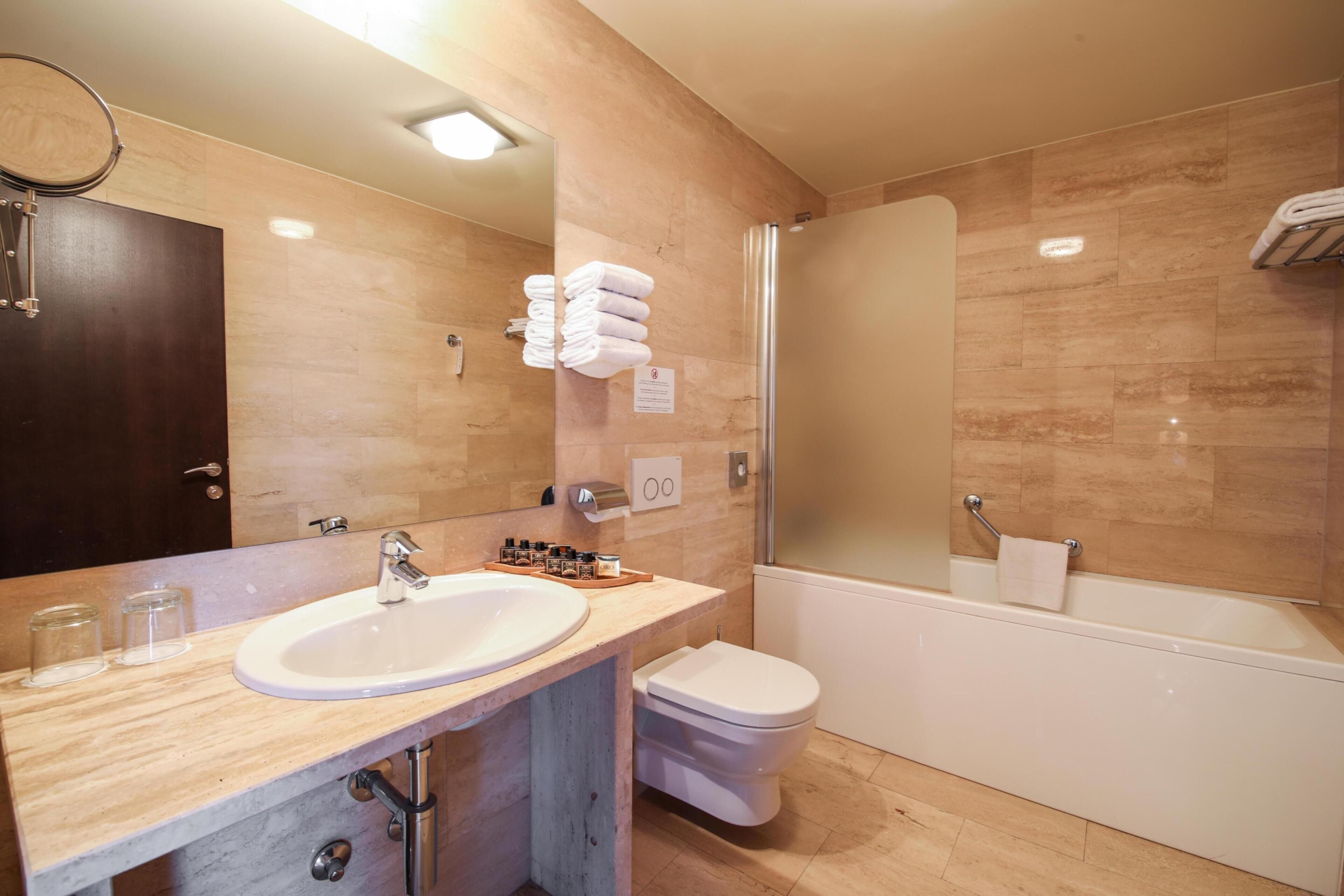 superior double room | bathroom | shower, hair dryer, slippers, towels