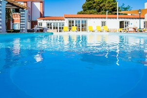Outdoor pool, open 8 AM to 9 PM, pool umbrellas, sun loungers