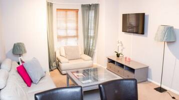 Standard Apartment, 2 Bedrooms | Living room | TV