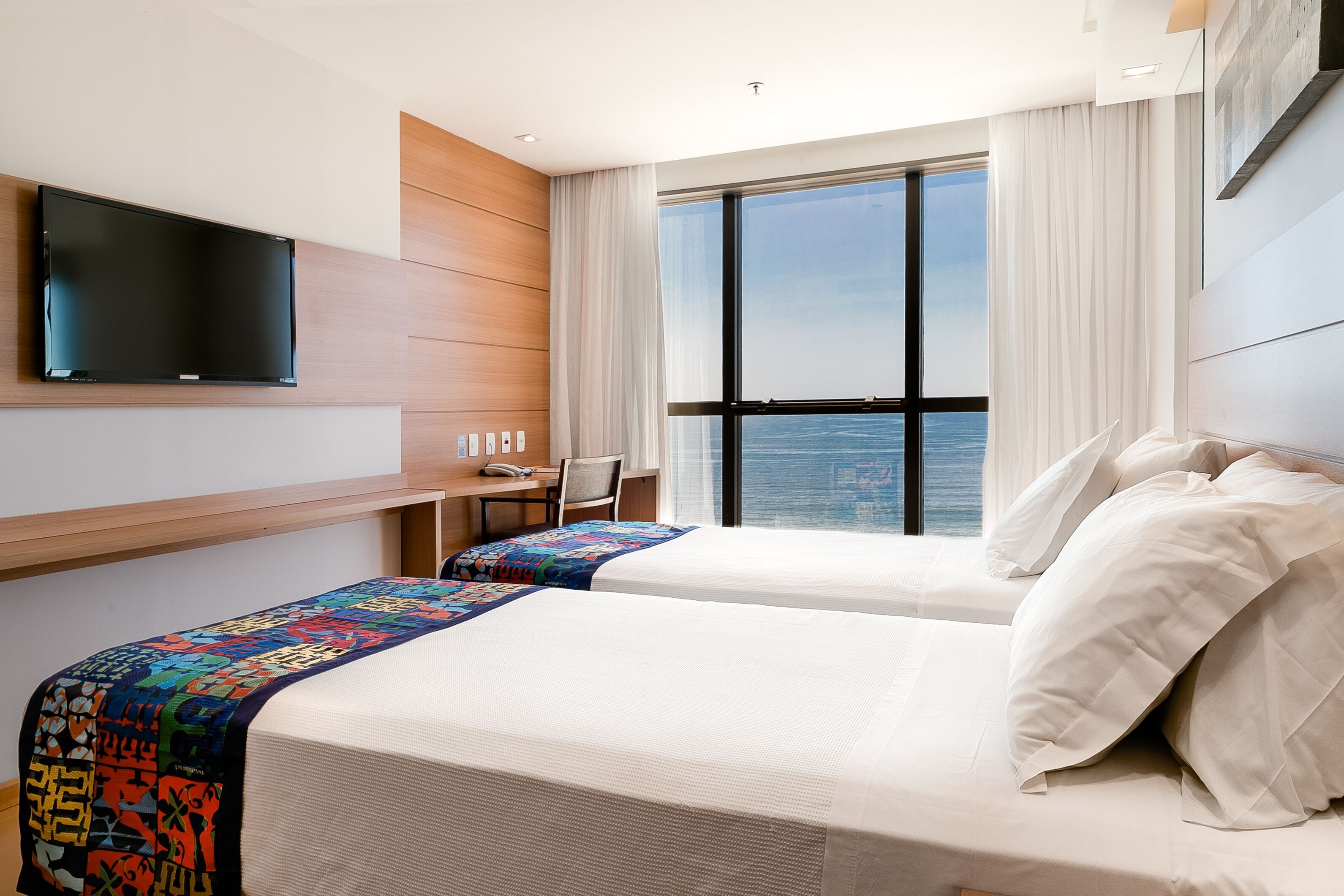 deluxe room, 2 single beds, sea view | minibar, in-room safe, desk, laptop workspace
