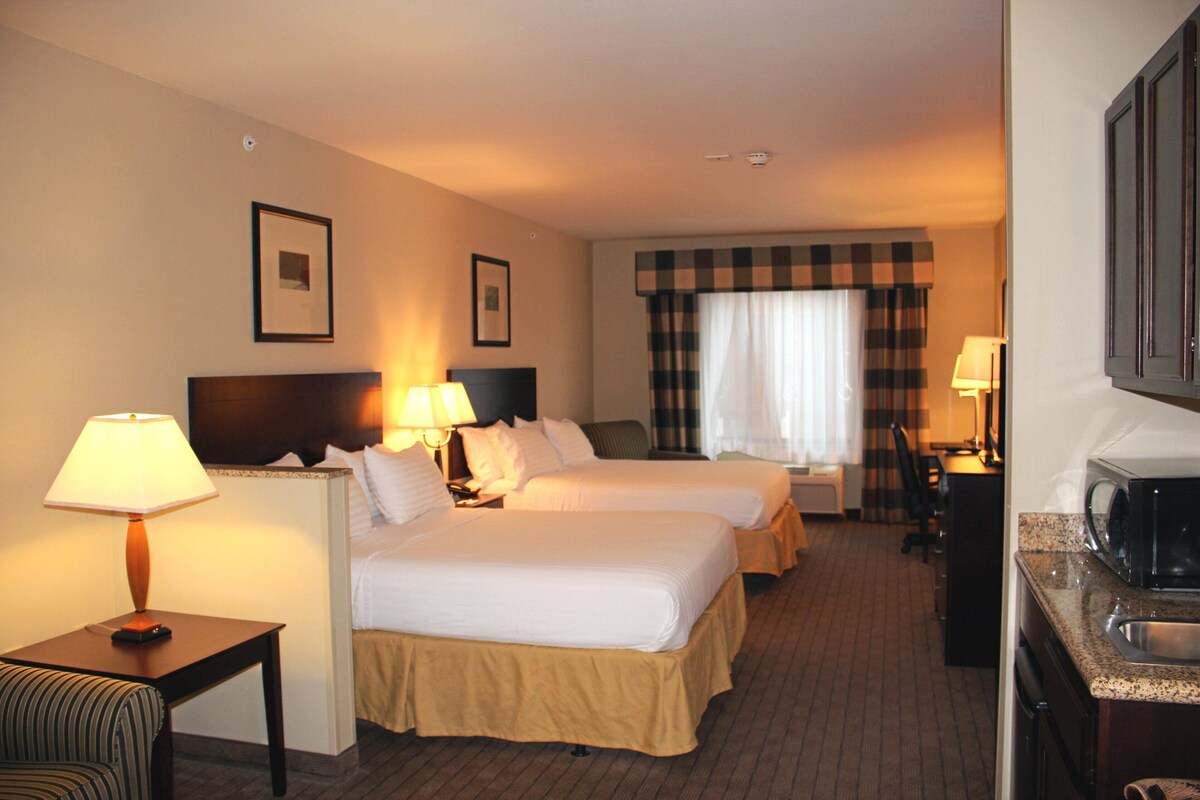 Suite, 2 Queen Beds | In-room safe, desk, iron/ironing board, free cots/infant beds