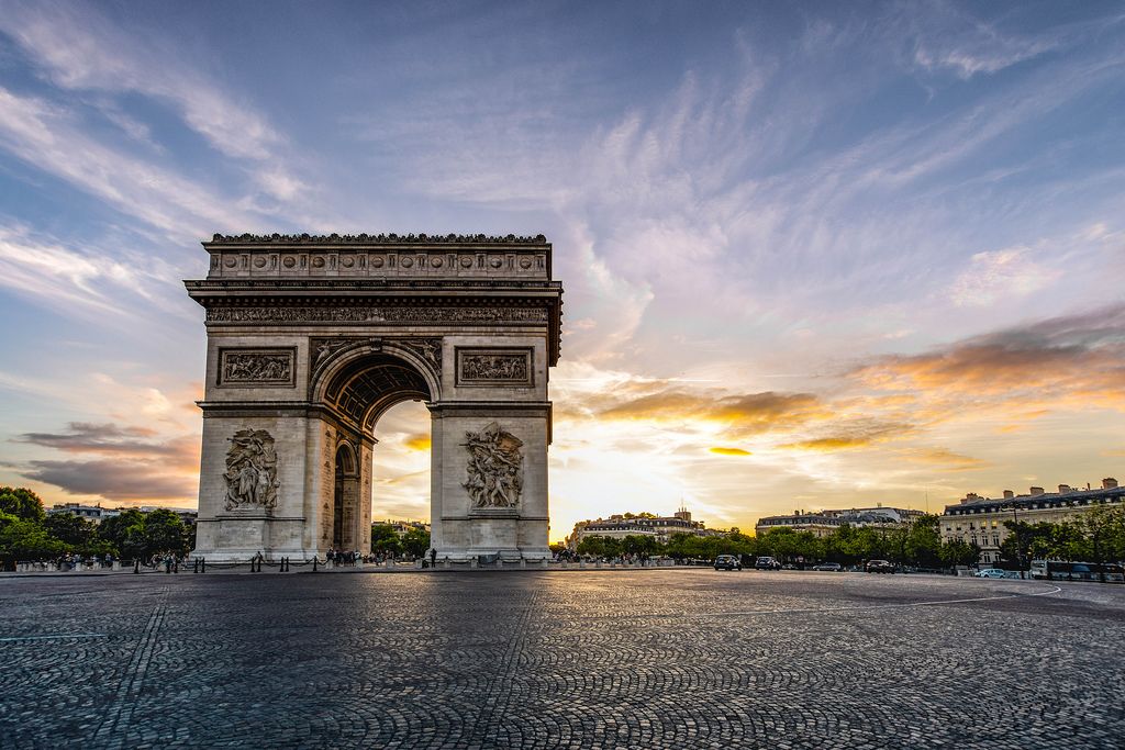The Arc de Triomphe in Paris, featuring intricate carvings and a large archway.