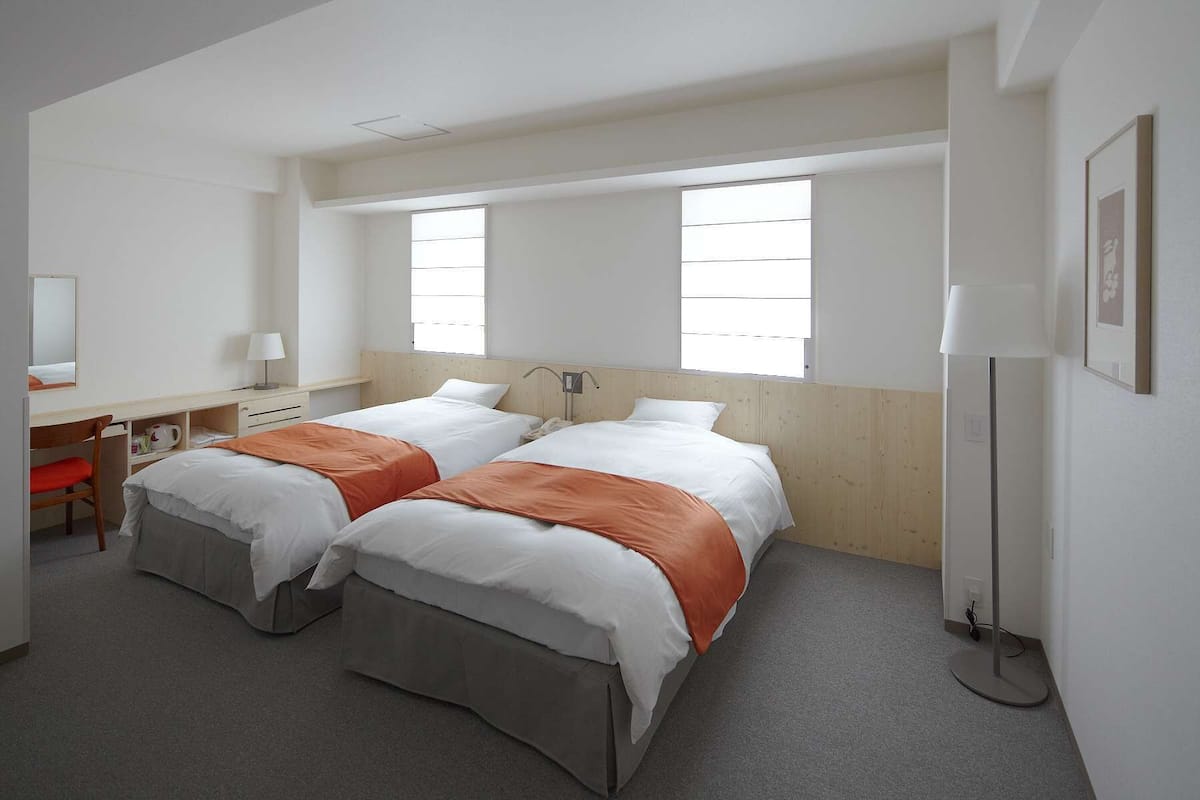 Superior Twin Room, Non Smoking | Down comforters, desk, blackout drapes, iron/ironing board