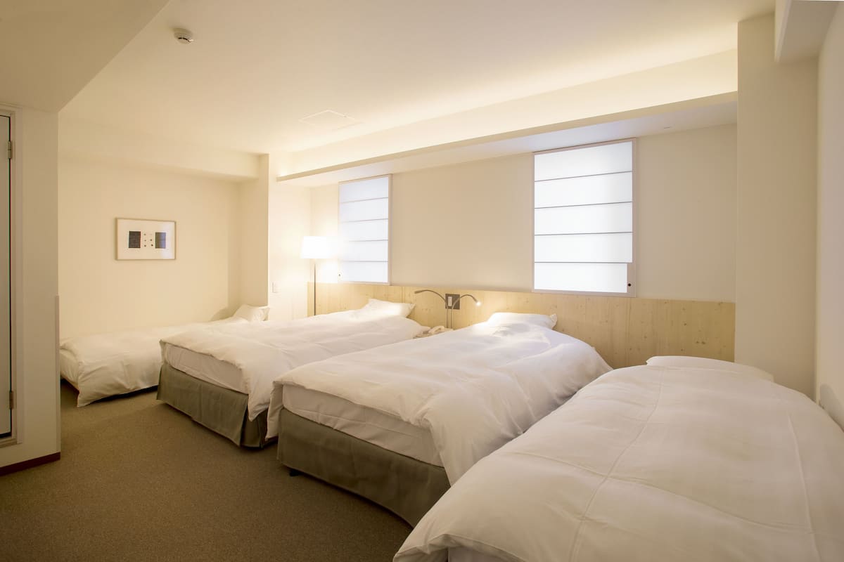 Superior Quadruple Room, Non Smoking | Down comforters, desk, blackout drapes, iron/ironing board