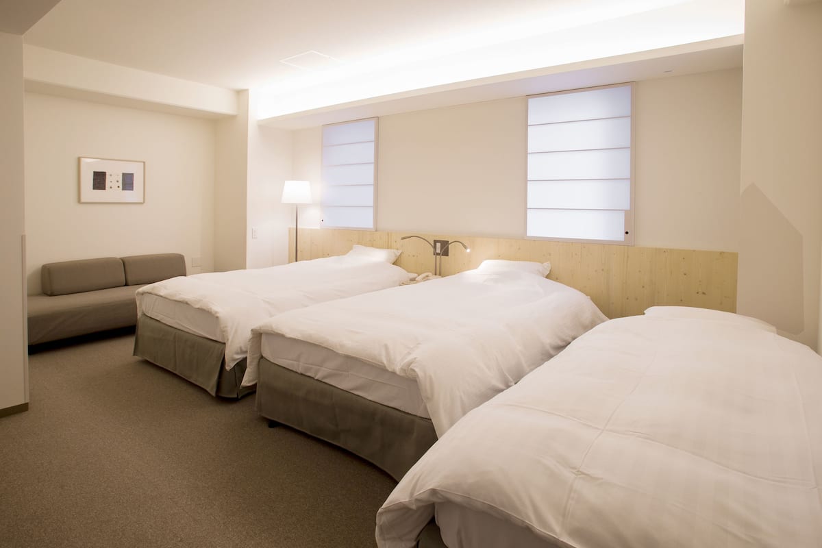 Superior Triple Room, Non Smoking | Down comforters, desk, blackout drapes, iron/ironing board
