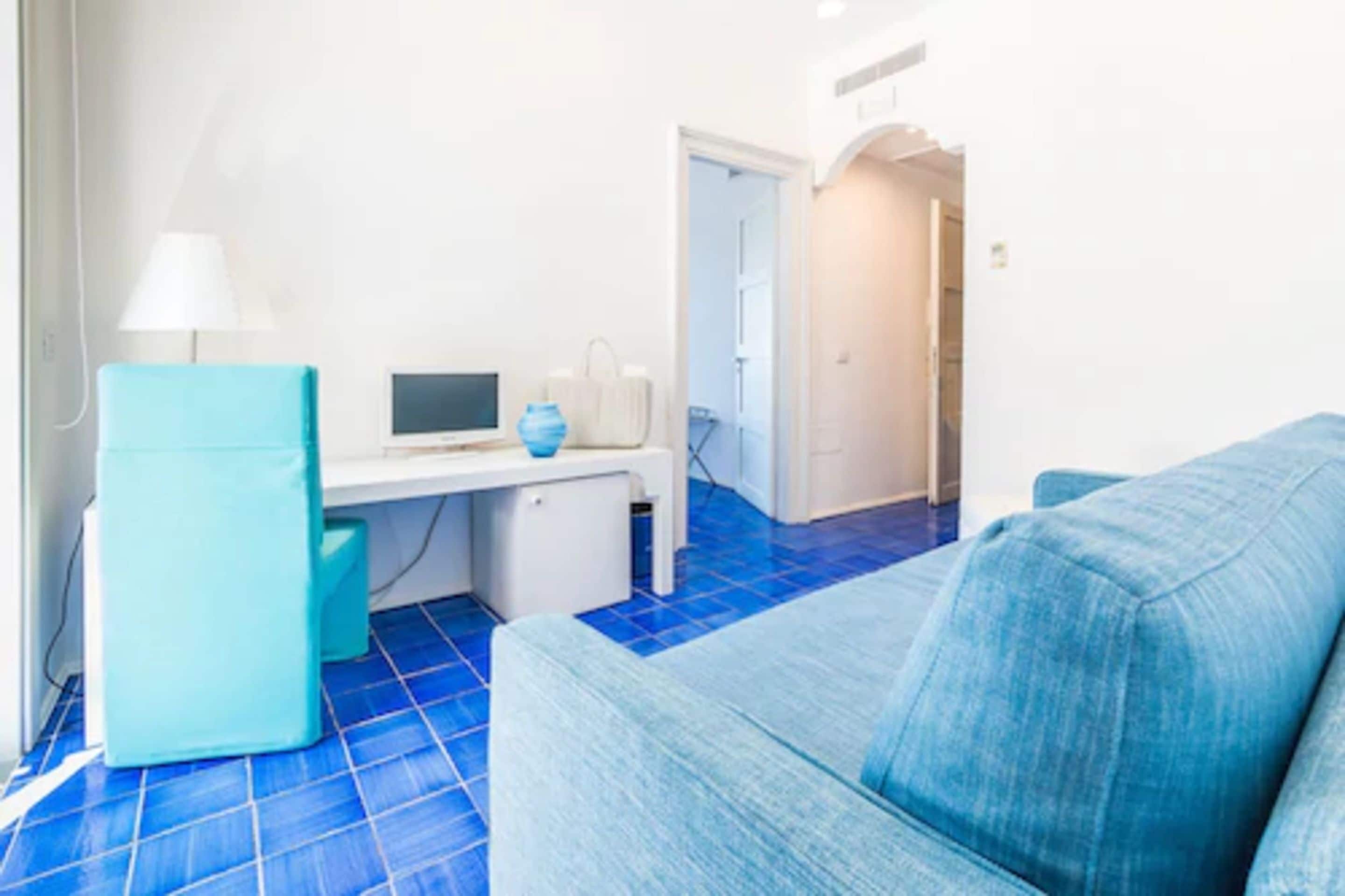 junior suite, 1 bedroom, balcony, sea view | living room | lcd tv, pay films