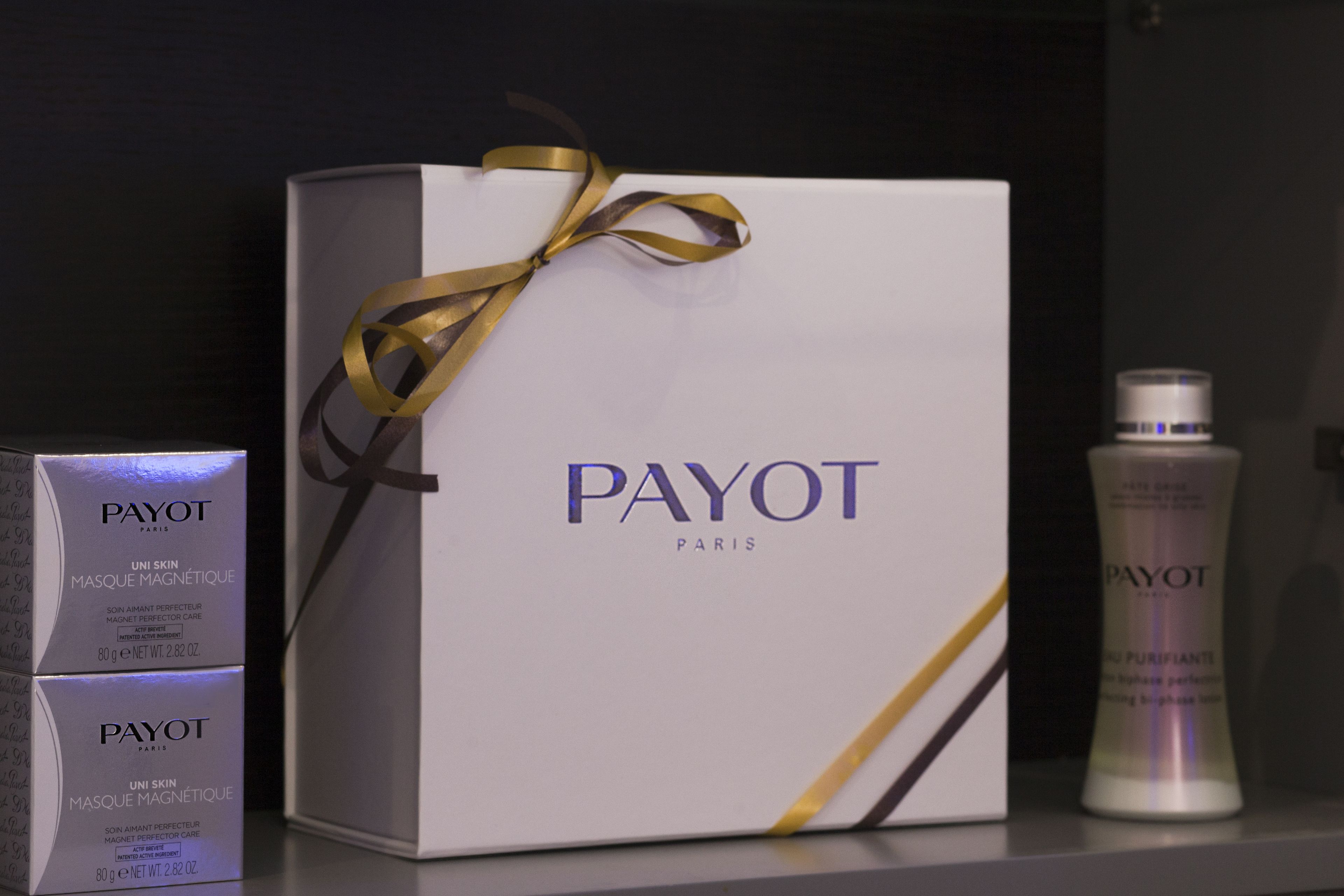 A PAYOT Paris skincare product box and bottles.